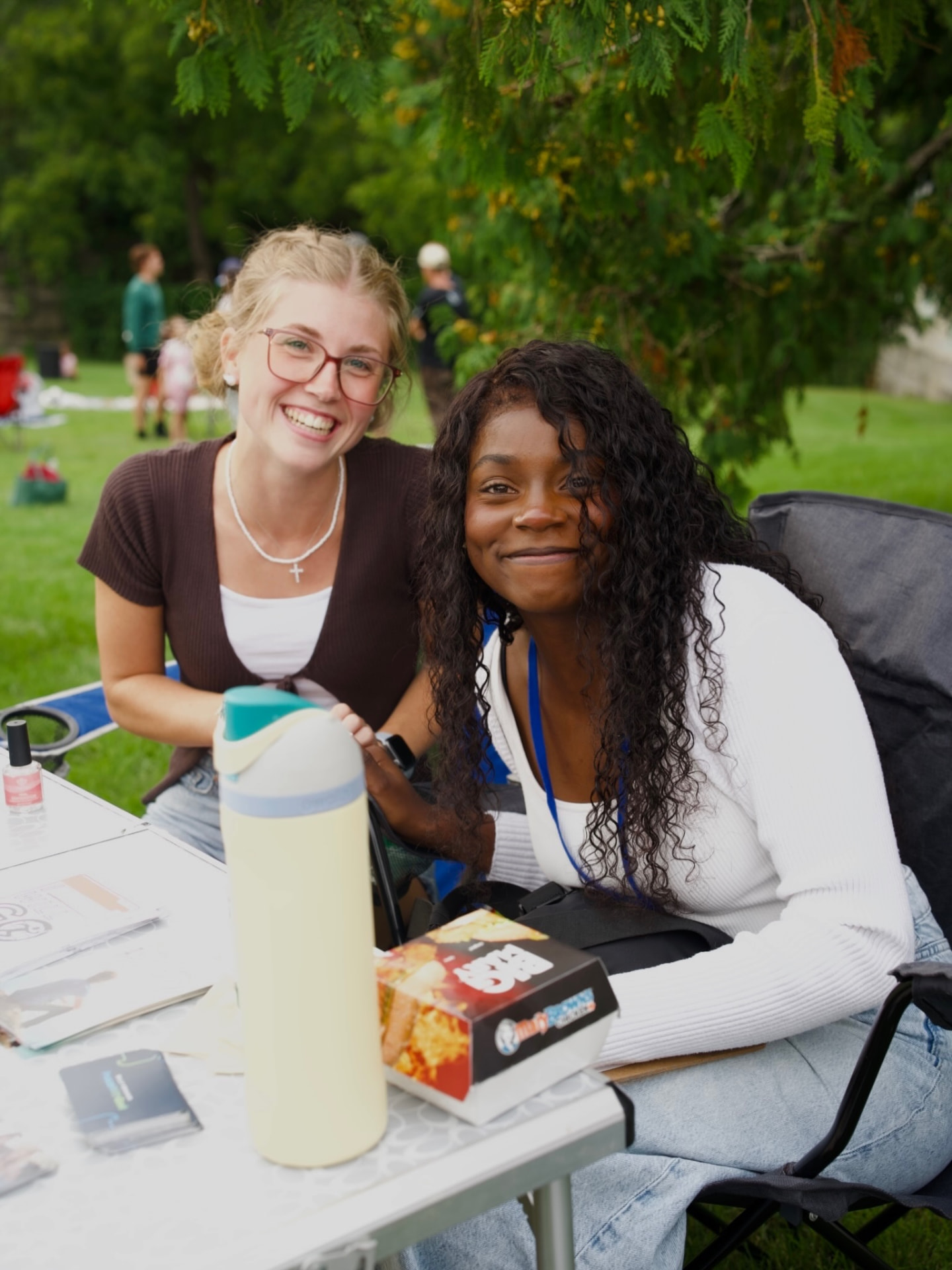 Two friends smiling together at a Souled Out gathering