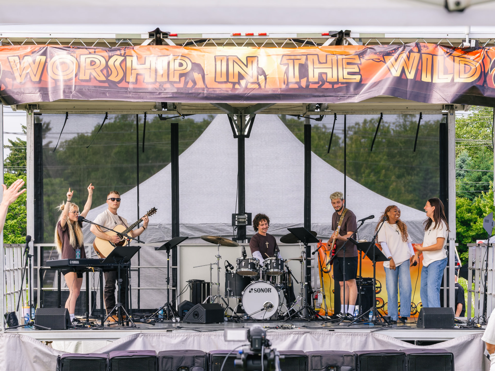 The worship team leading from the Worship in the Wild stage
