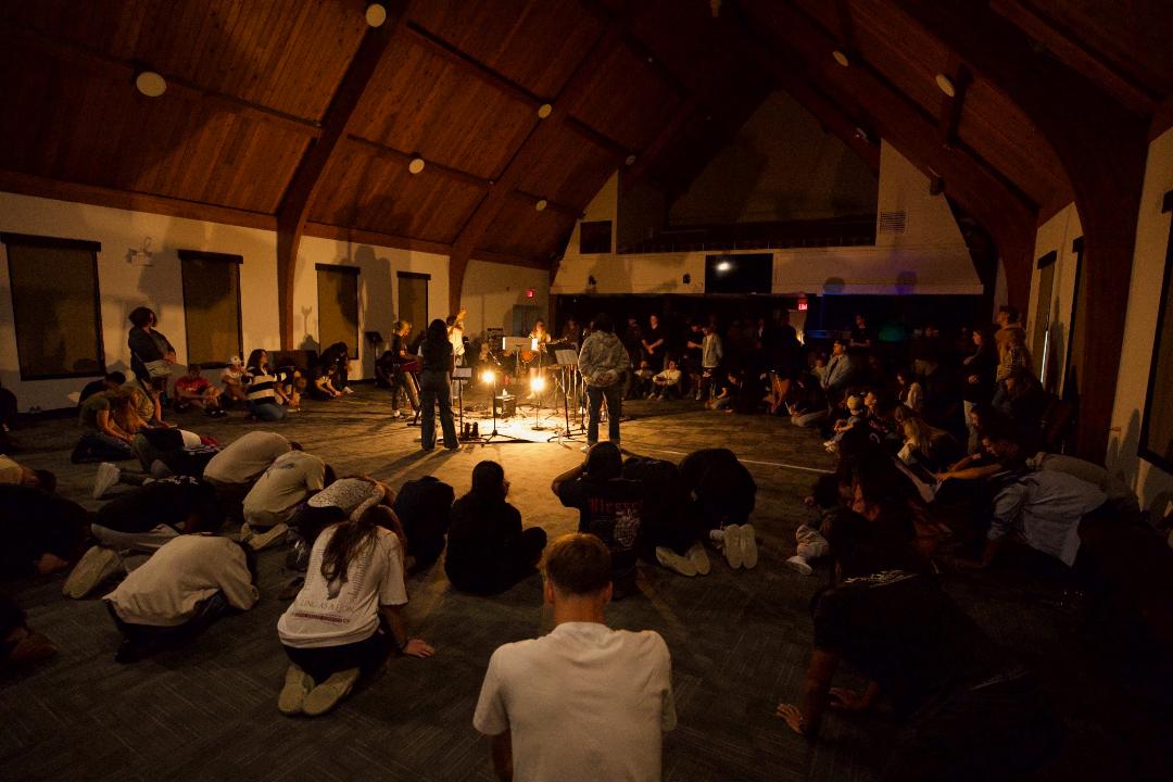 A room full of young people worshipping at a Souled Out night