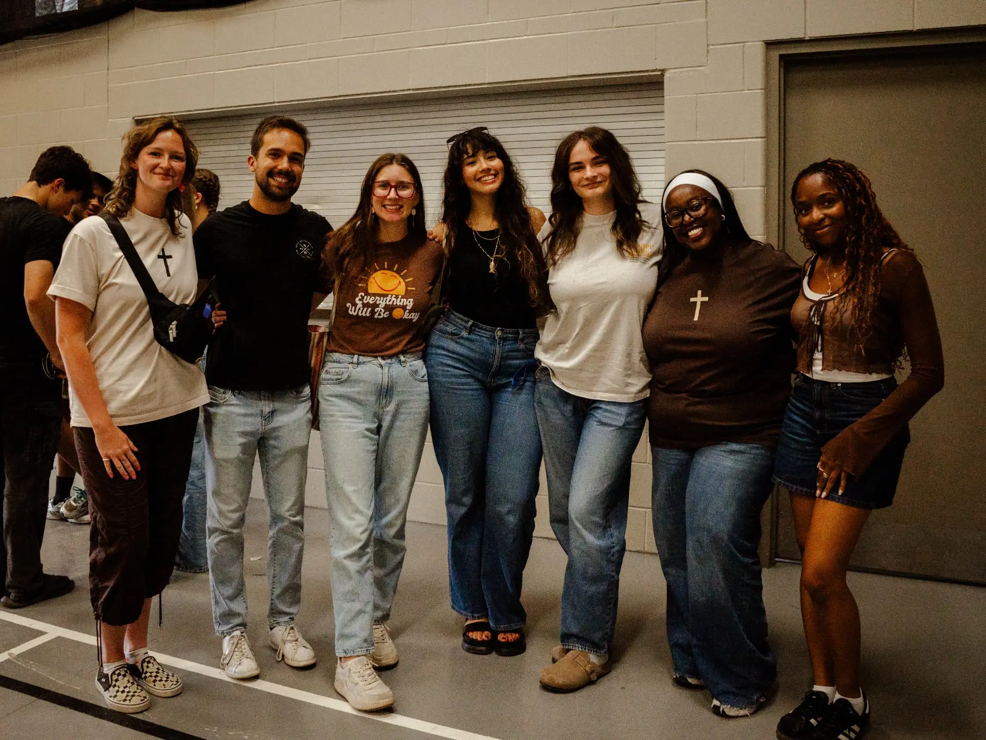 Eight friends from the Souled Out community standing together after a gathering