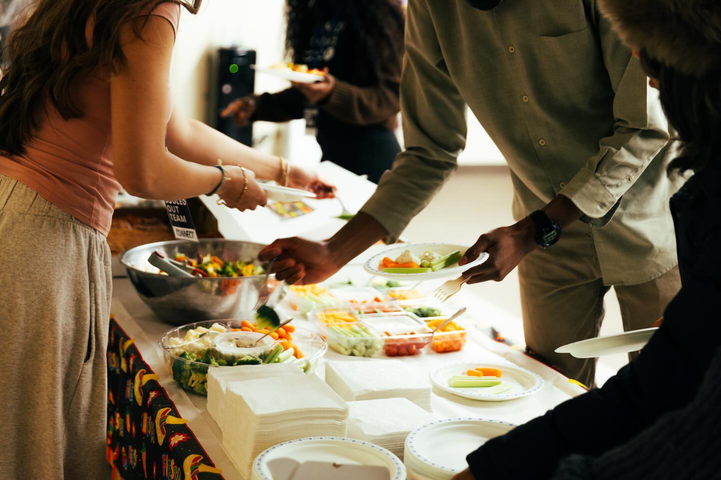 Guests sharing food and fellowship at a Souled Out gathering